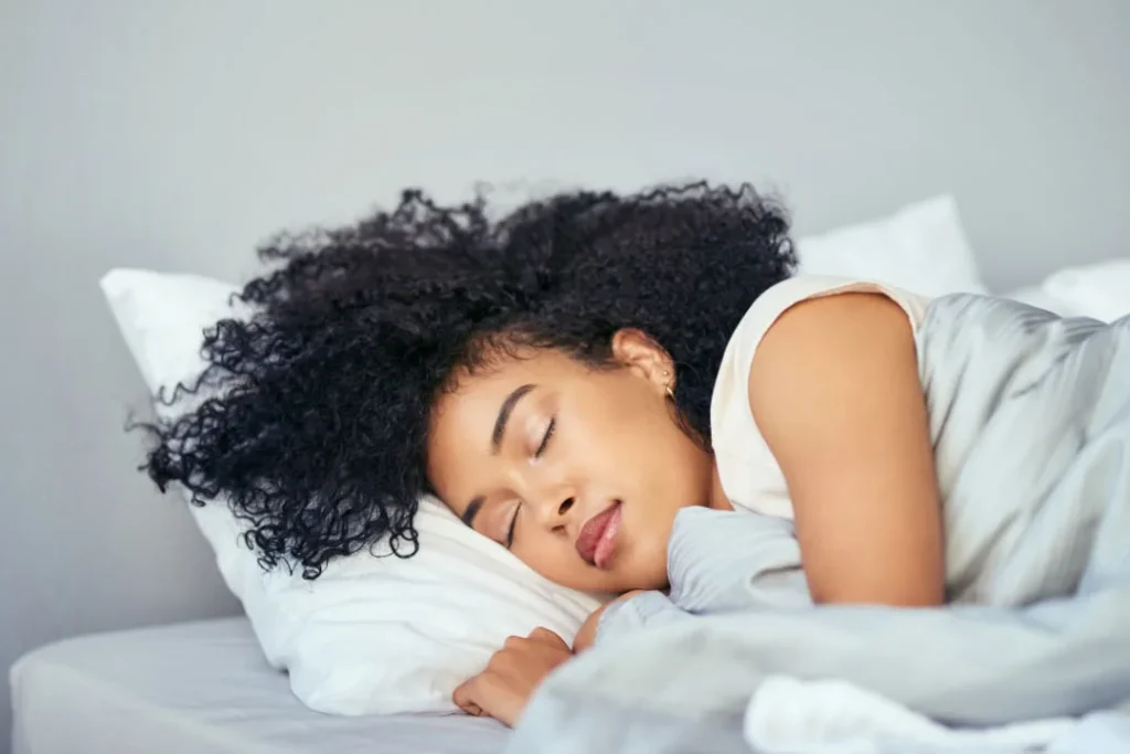 A brown girl enjoying a healthy sleep. 