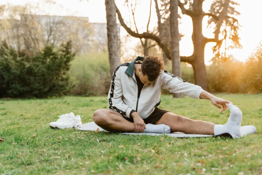 A man doing exercise in a park. 