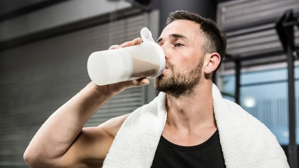 Man having protein shake. 